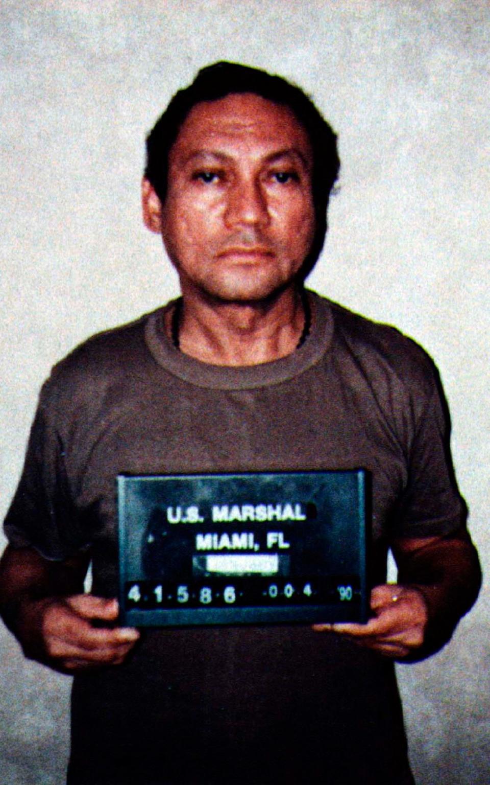 Noriega during his arrest by US Drug Enforcement Agency agents in 1990 - Credit: Reuters