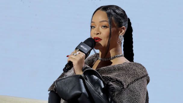 PHOTO: Rihanna speaks onstage during the Super Bowl LVII Pregame & Apple Music Super Bowl LVII Halftime Show Press Conference at Phoenix Convention Center, Feb. 9, 2023, in Phoenix. (Mike Coppola/Getty Images)