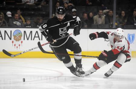 December 7, 2017; Los Angeles, CA, USA; Los Angeles Kings defenseman Drew Doughty (8) moves the puck ahead of Ottawa Senators center Jean-Gabriel Pageau (44) during the first period at Staples Center. Mandatory Credit: Gary A. Vasquez-USA TODAY Sports