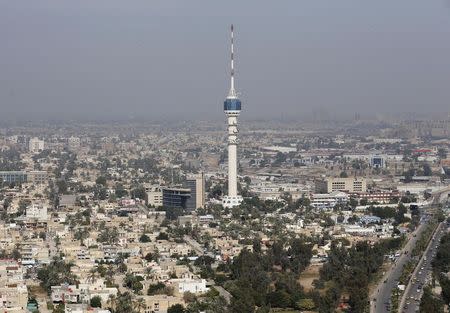 Iraq's Mamoun Tower is seen from U.S. Secretary of Defense Chuck Hagel's helicopter, as it flies over the city, in Baghdad, December 9, 2014. U.S. Defense Secretary Chuck Hagel arrived in Baghdad on Tuesday as the United States expands its presence and touts progress against Islamic State militants four months after starting a campaign of air strikes in Iraq. REUTERS/Mark Wilson/Pool (IRAQ - Tags: POLITICS CITYSCAPE BUSINESS TELECOMS)