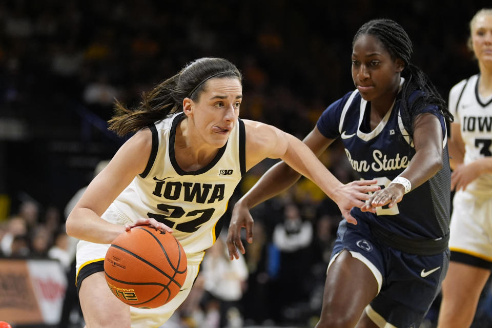 Iowa guard Caitlin Clark (22) drives to the basket past Penn State guard Jayla Oden (12) during the first half of an NCAA college basketball game, Thursday, Feb. 8, 2024, in Iowa City, Iowa. (AP Photo/Charlie Neibergall)