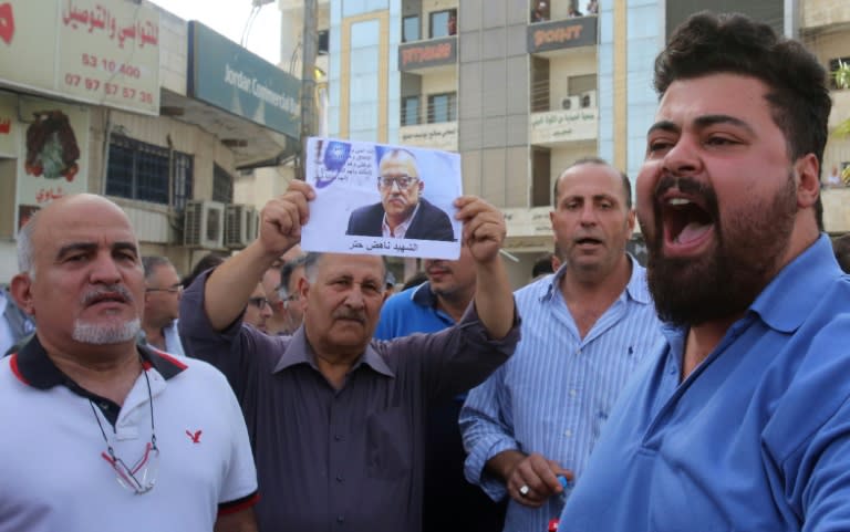 Demonstrators rally in the town of Fuheis near Amman on September 25, 2016, denouncing the killing of prominent Jordanian writer Nahed Hattar