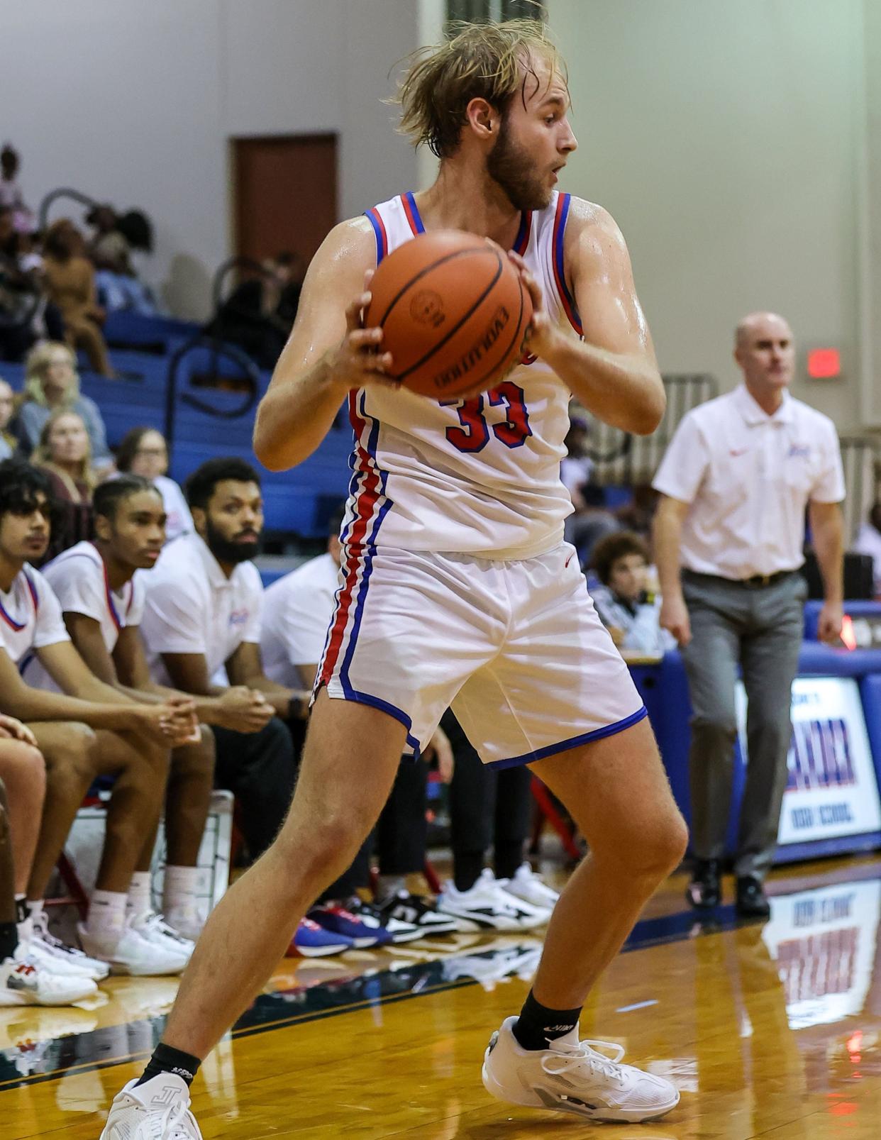 Leander's Sean Dalberg (33) looks to pass against Connally in a non-district matchup Nov. 28, 2023, at Leander High. Visiting Connally held on to top Leander, 37-32, in a defensive battle.