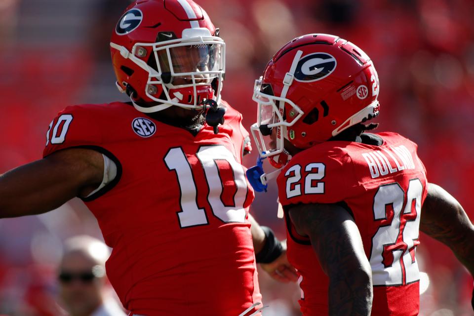 Georgia wide receiver Tyler Williams (10) and Georgia defensive back Javon Bullard (22) warm up before the start of a NCAA college football game against Tennessee Martin in Athens, Ga., on Saturday, Sept. 2, 2023.