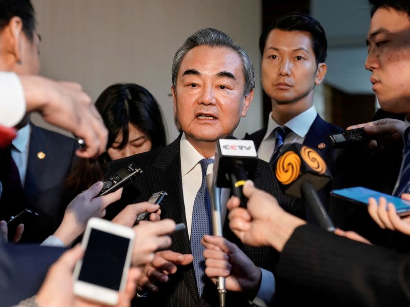 FILE PHOTO: Chinese Foreign Minister Wang Yi meets Japanese Prime Minister Shinzo Abe