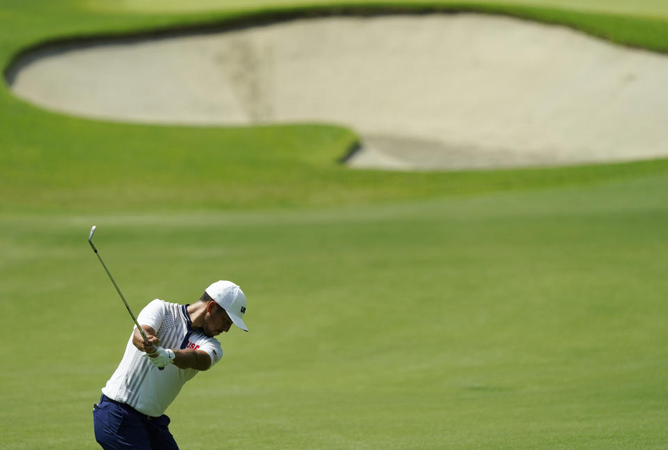 Xander Shauffele of United States plays a shot from the 9th fairway during the third round of the men's golf event at the 2020 Summer Olympics on Saturday, July 31, 2021, in Kawagoe, Japan. (AP Photo/Matt York)