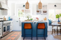 <p> Kitchen color ideas in a white scheme with blue kitchen island, orange bar stools, rattan pendant lighting and wooden flooring. </p> <p> Natasha adds, &apos;Another recommendation which works extremely well if you&apos;ve got an island is to change the color.&apos; </p> <p> This could either be with a totally different color, or by going for a brighter or darker version of a shade that&apos;s been used in the rest of the room. This is just one of many kitchen island ideas you can play about with. </p> <p> The beauty of this trick is that it injects color but still gives you a light and breezy feel.&#xA0; </p> <p> Painting your island, like Cali based interior designer Kate Lester has here, will work like an accent color does &#x2013; you&#x2019;re just using it on a larger item. You can then link that color through into your accessories, like tableware, casserole dishes, lighting and rugs. To complete the Cali look, add in some rattan and natural wood.&#xA0; </p>