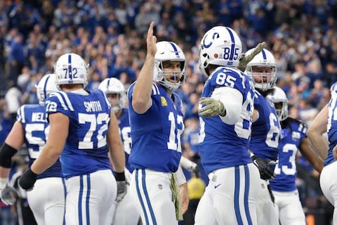 Indianapolis Colts tight end Eric Ebron (85) celebrates a touchdown with quarterback Andrew Luck (12) during the first half of an NFL football game against the Jacksonville Jaguars in Indianapolis - Credit: AP Photo/AJ Mast