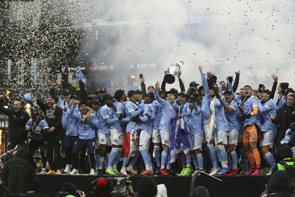 New York City FC players celebrate their penalty kick shootout win over the Portland Timbers in the MLS Cup soccer game, Saturday, Dec. 11, 2021, in Portland, Ore. (AP Photo/Amanda Loman)