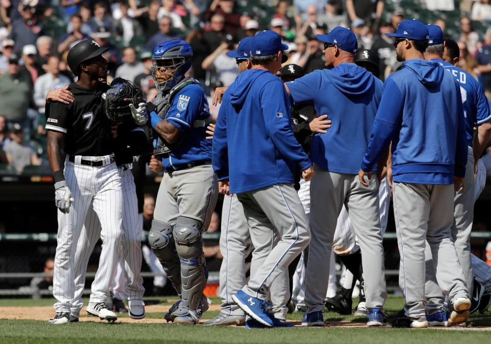 Chicago White Sox’s Tim Anderson, left, talks to Kansas City Royals catcher Martin Maldonado after being hit by a pitch during the sixth inning of a baseball game in Chicago, Wednesday, April 17, 2019. (AP Photo/Nam Y. Huh)