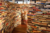 A child plays in the 'aMAZEme' labyrinth made from books at The Southbank Centre on July 31, 2012 in London, England. (Photo by Peter Macdiarmid/Getty Images)
