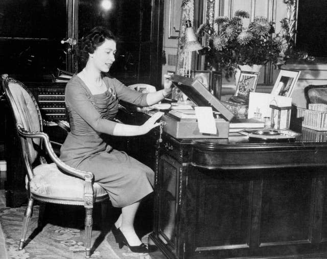 The Queen at her desk