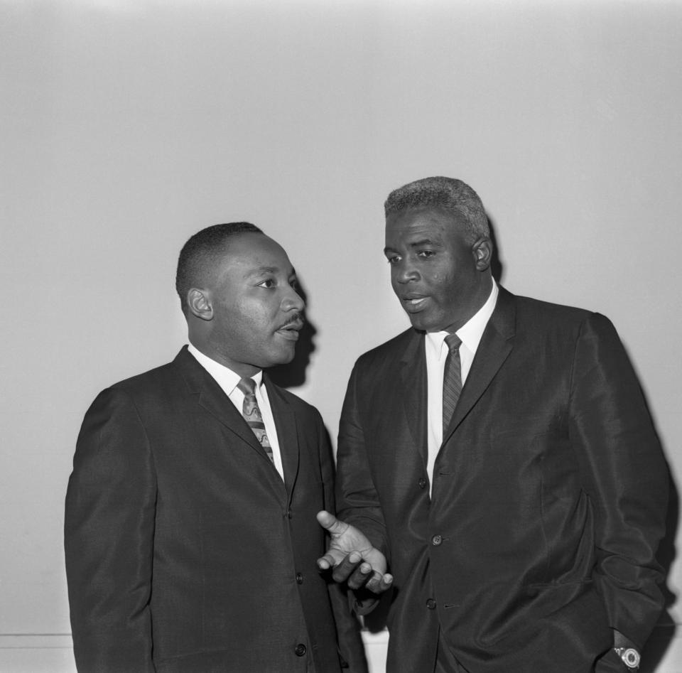 The Rev. Dr. Martin Luther King Jr. (L) and baseball Hall-of-Famer Jackie Robinson chat together before a press conference in New York, September 19th. Dr. King, who arrived to open a drive for funds and a northern 