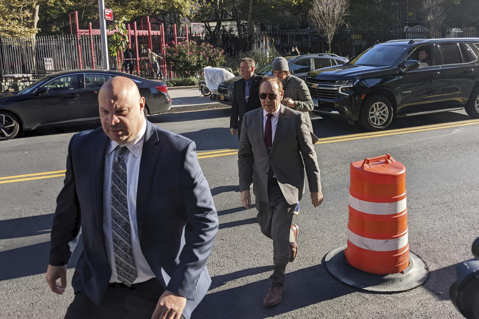 Actor Kevin Spacey arrives at federal court for a civil trial in the Manhattan borough of New York City with his security detail on Wednesday, Oct. 19, 2022. Actor Anthony Rapp claims Spacey made a sexual pass at him when he was 14 in the 1980s. He's seeking up to $40 million. Spacey testified that the encounter Rapp describes never happened. (AP Photo/Ted Shaffrey)