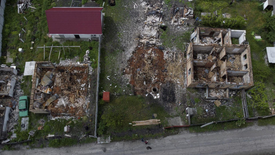A view of the home of Eduard Zelenskyy and Nila Zelinska destroyed by attacks in Potashnya, on the outskirts of Kyiv, Ukraine, Tuesday, May 31, 2022. (AP Photo/Natacha Pisarenko)