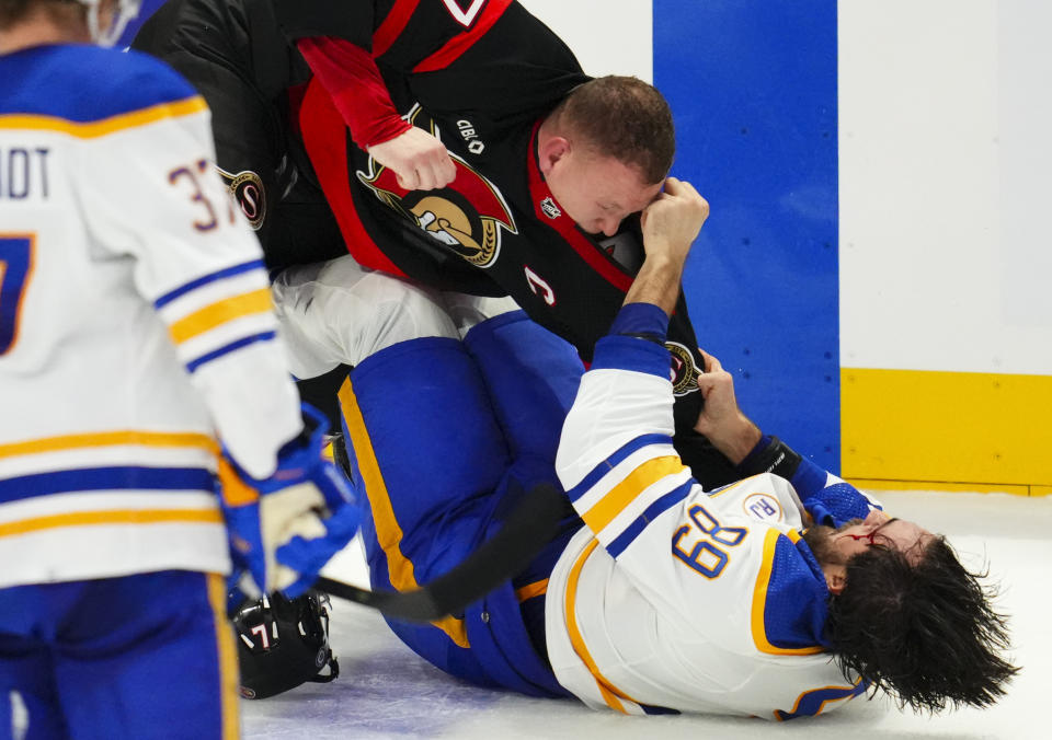 Ottawa Senators left wing Brady Tkachuk, left, and Buffalo Sabres right wing Alex Tuch fight during the third period of an NHL hockey game Tuesday, Oct. 24. 2023, in Ottawa, Ontario. (Sean Kilpatrick/The Canadian Press via AP)