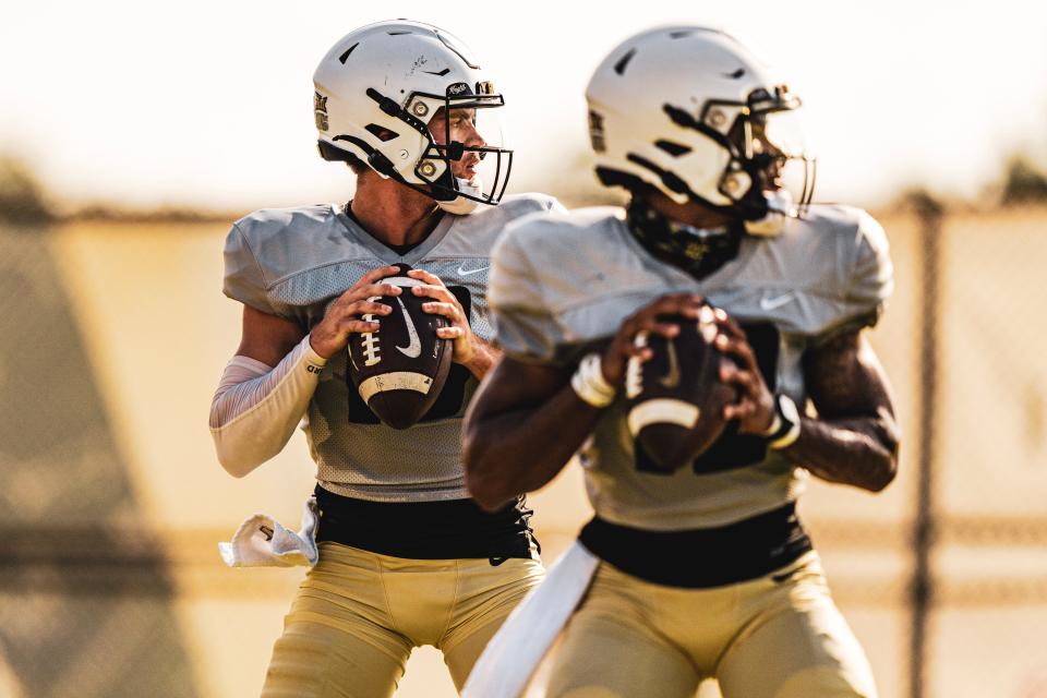 John Rhys Plumlee and Thomas Castellanos drop back to pass during UCF spring football practice.