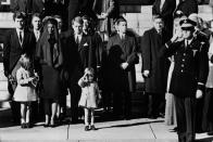 <p>Outside the Cathedral of St. Matthew the Apostle in Washington D.C., John F. Kennedy Jr. salutes his father's coffin. </p>