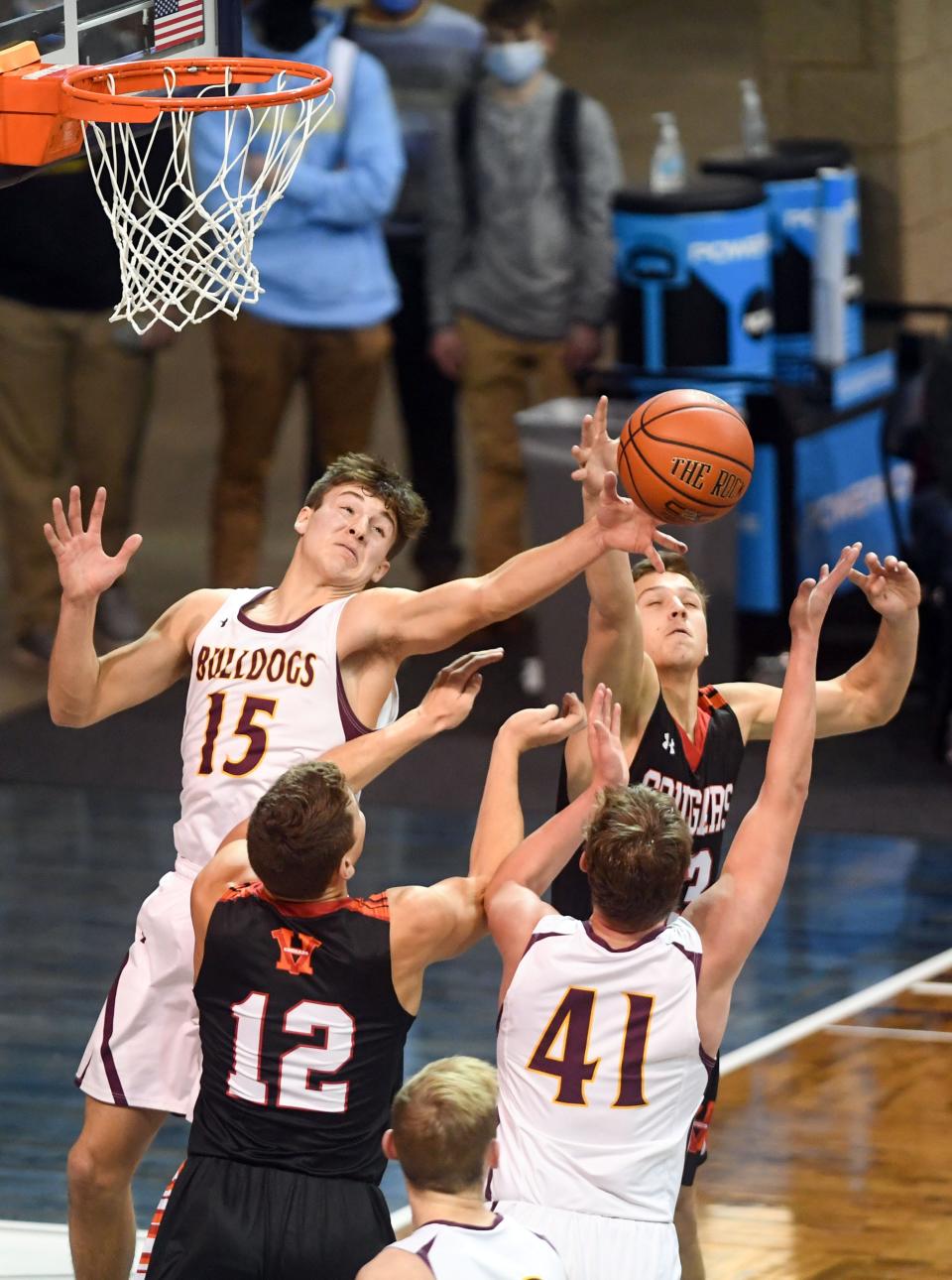 De Smet's Kalen Garry and Tory Holland compete with Viborg-Hurley's Gradee Sherman and Calvin Rasmussen for a rebound on Saturday, January 2, the Sanford Pentagon in Sioux Falls.