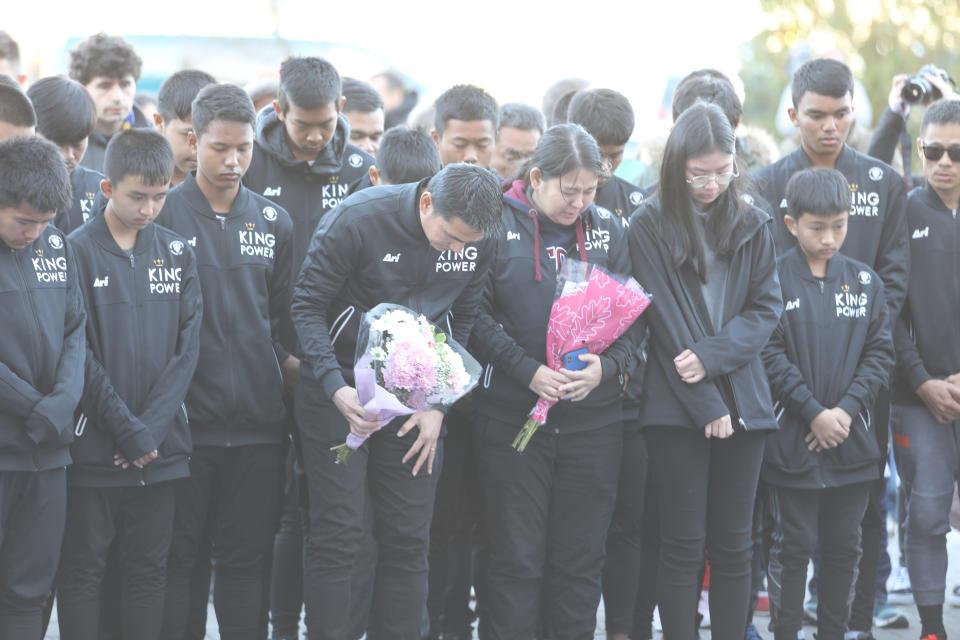 Players from the Fox Hunt Football Academy in Thailand pay an emotional tribute