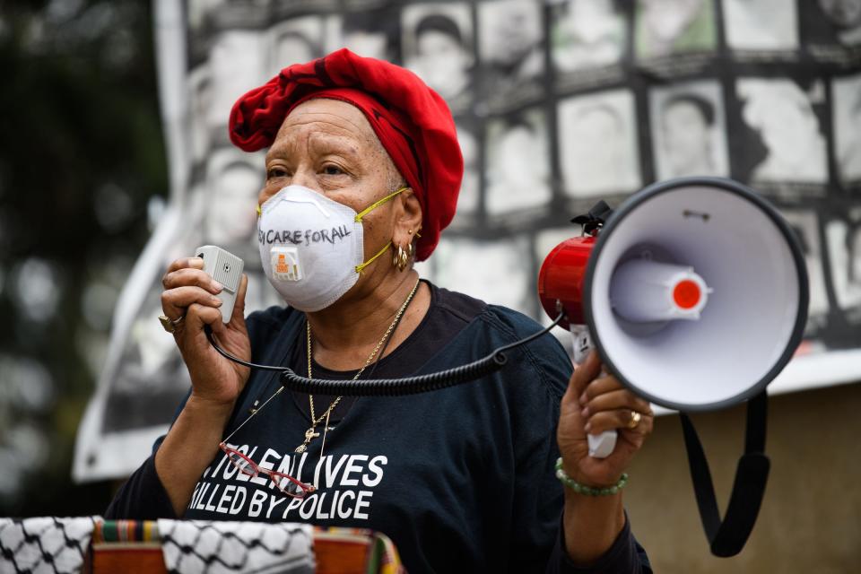 Efia Nwangaza speaks during an anti-hate rally at the statue of a Confederate solider downtown Saturday March 27, 2021.