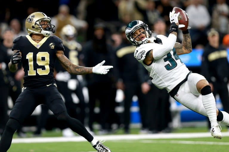 Cre'von LeBlanc of the Philadelphia Eagles intercepts a pass over Ted Ginn of the New Orleans Saints during the NFC Divisional Playoff