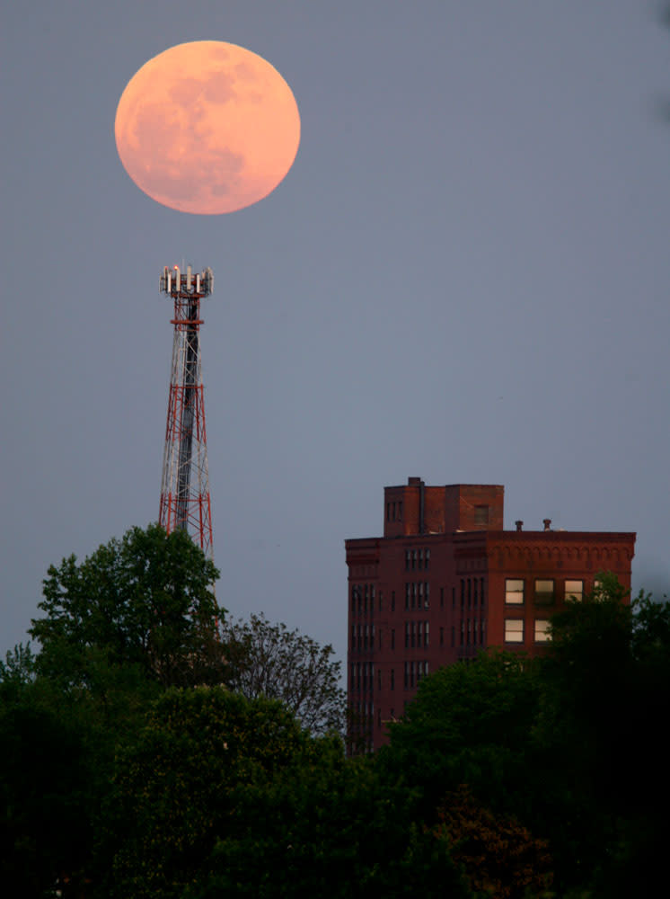 The "supermoon" rises over the Renkert Building, Saturday, May 5, 2012 in Canton, Ohio. The biggest and brightest full moon of the year arrives Saturday night, May 5 as our celestial neighbor passes closer to Earth than usual.