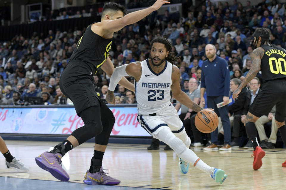 Memphis Grizzlies guard Derrick Rose (23) drives against Utah Jazz center Omer Yurtseven (77) in the second half of an NBA basketball game Wednesday, Nov. 29, 2023, in Memphis, Tenn. (AP Photo/Brandon Dill)