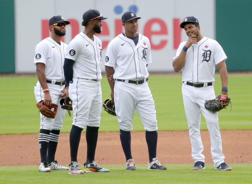 Detroit Tigers' Willi Castro (49) Niko Goodrum (28) Jonathan Schoop (8) and Jeimer Candelario (46) talk during a break in the action against the Cleveland Indians  at Comerica Park, Sunday, Aug. 16, 2020.