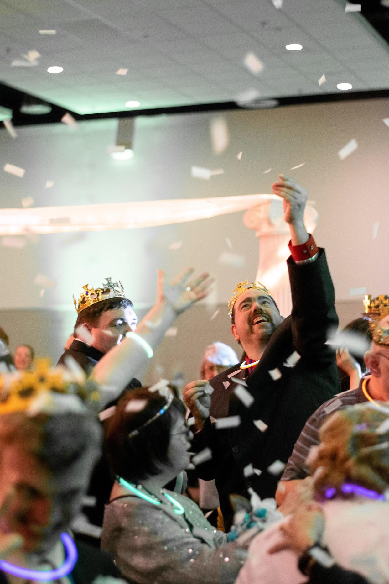 Immediately following the crowning of prom kings and queens, confetti is dropped on the crowd to help celebrate during the Night to Shine. The event is a prom for special needs individuals over the age of 14, sponsored by the Tim Tebow Foundation and hosted locally by Stop 9 Church of Christ in Byesville.