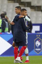 France's Kylian Mbappe and Portugal's Cristiano Ronaldo, left, greet each other at the end of the UEFA Nations League soccer match between France and Portugal at the Stade de France in Saint-Denis, north of Paris, France, Sunday, Oct. 11, 2020. (AP Photo/Thibault Camus)