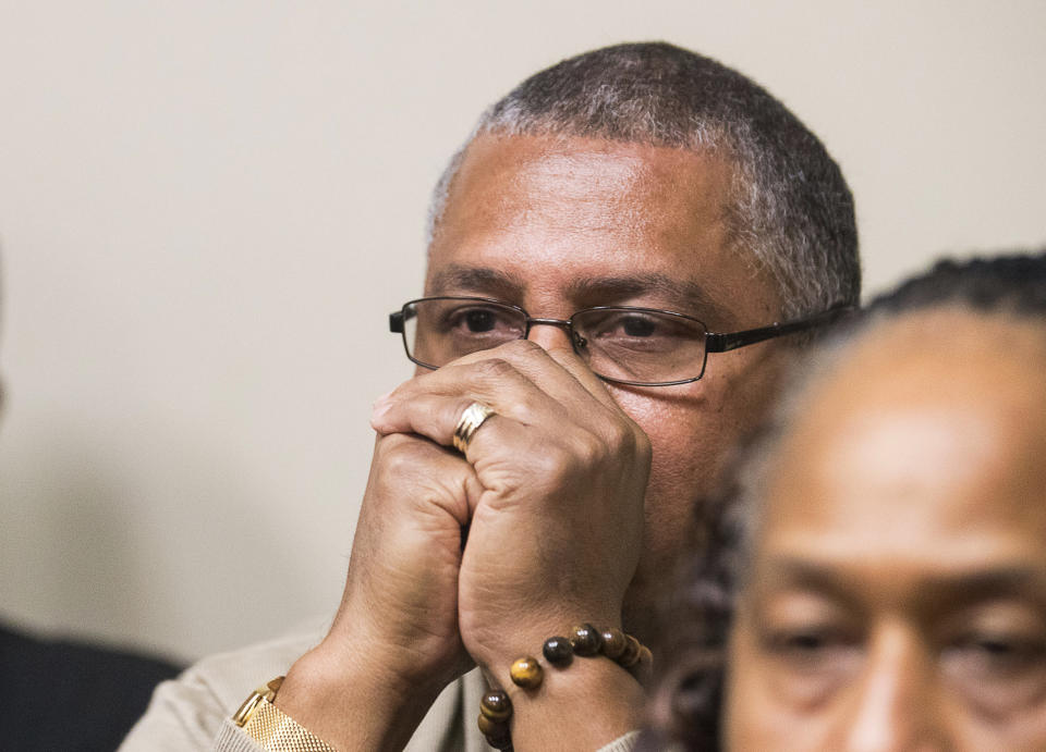 Anthony Hill Sr. listens as the verdict for Robert "Chip" Olsen is read aloud in front of DeKalb County Superior Court Judge LaTisha Dear Jackson at the DeKalb County Courthouse in Decatur, Ga., Monday, Oct. 14, 2019. A former Georgia police officer who fatally shot Hill's son, an unarmed, naked man, was found not guilty of murder on Monday, but was convicted of aggravated assault and other charges that could potentially send him to prison for more than 30 years. (Alyssa Pointer/Atlanta Journal-Constitution via AP, Pool)