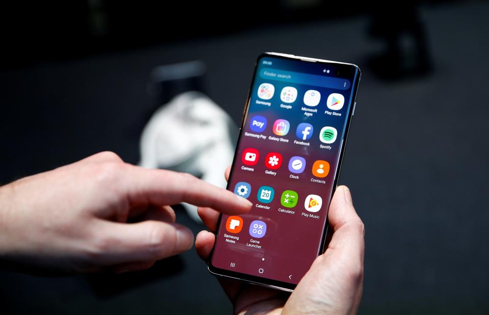 FILE PHOTO: A journalist uses the new Samsung Galaxy S10 smartphone at a press event in London, Britain February 20, 2019. REUTERS/Henry Nicholls/File Photo