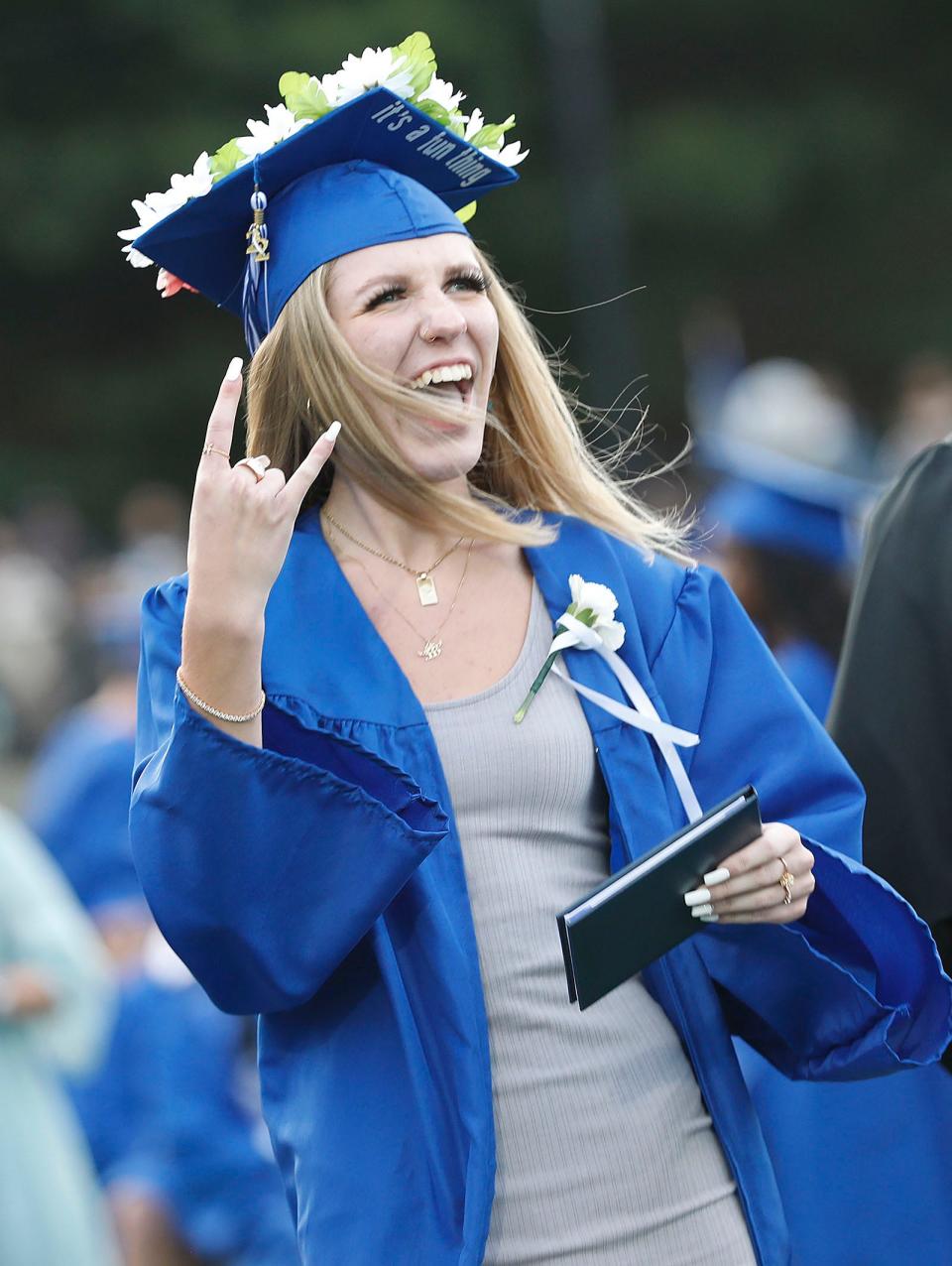 Quincy High graduate Tia Nicole DiBona breaks out in wide smile during graduation ceremonies at Veterans Stadium for more than 400 graduates on Tuesday, June 7, 2022.