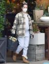 <p>Ashley Tisdale shows off her growing baby bump as she visits Rolling Greens Nursery with husband Christopher French in L.A. on Friday. </p>