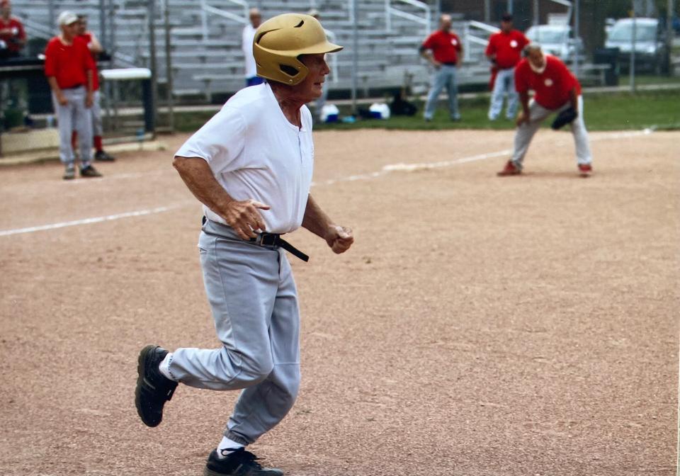 Retired Ashland City Schools science teacher, former mayor of Ashland and current lily pollinator extraordinaire Doug Cellar beats out an infield single for the Huff-N-Puffers.