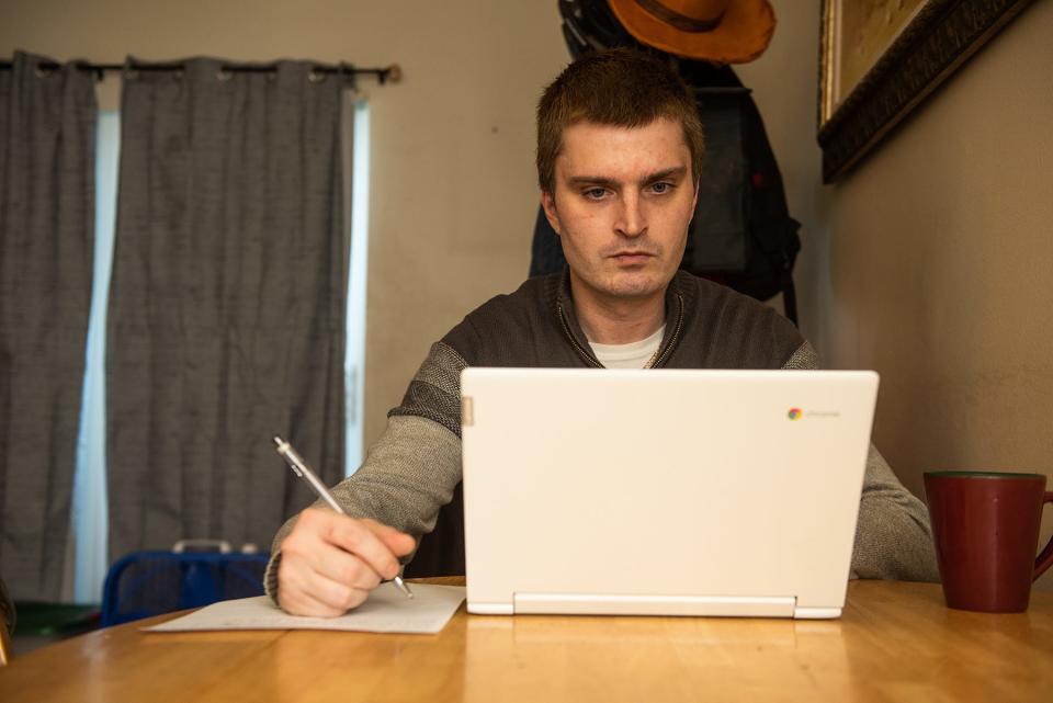 Joe Hannigan of Walden uses his computer as he sits for a portrait at his home in Walden, NY on Tuesday, January 11, 2022.