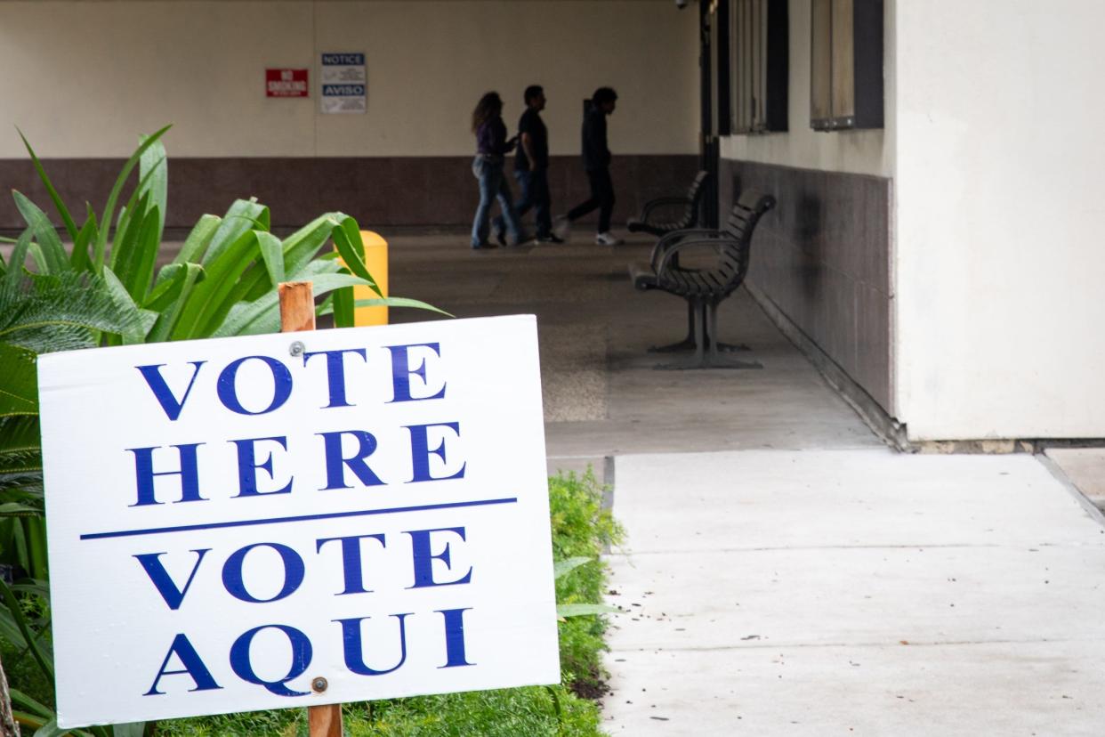 In this October file photo, people enter the Nueces County Courthouse, an early voting polling location.