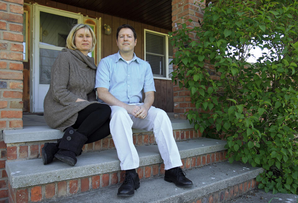 In this Tuesday, April 24, 2012 photo, Sarah and Devin Stang sit on the porch of the home they are renting in LaGrange, Ohio. The Stangs filed for bankruptcy and lost their Sandusky, Ohio home to foreclosure, but due to a 2005 law their student loan debts are still not dischargeable. (AP Photo/Mark Duncan)