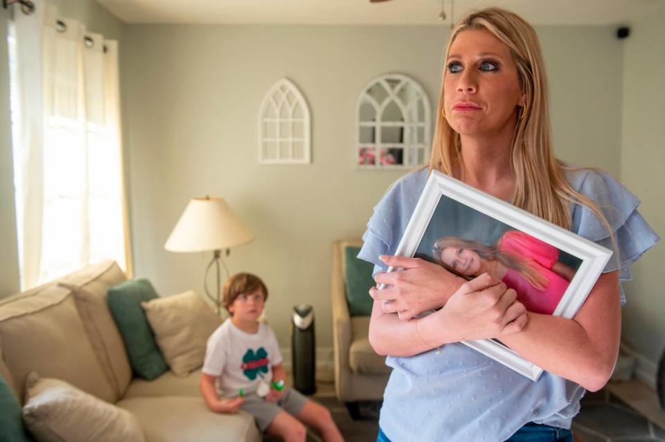 Heather Wyatt holds a picture of her daughter Aubreigh on Tuesday, March 12, 2024. Aubreigh died by suicide on Labor Day at her home in Ocean Springs. Her brother Ryker, left, still brings toys and things she would’ve liked to Aubreigh’s room, which has sat untouched since her death.