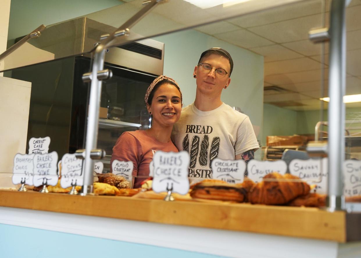 Alisyn and Arlo Brandl pose for a photo at their current shop on South Evans Street in Tecumseh.