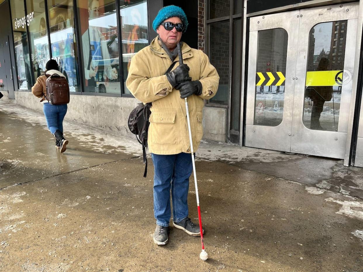  Yves-Marie Lefebvre said he has to avoid certain intersections in Montreal, and can't even go out on some days due to the lack of infrastructure for people who are blind.   (Paula Dayan-Perez/CBC - image credit)