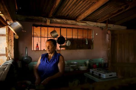 Farmer Vaziliza Gonzales prepares lunch in her ranch near San Antonio de los Banos village in Artemjsa province, Cuba, April 12, 2016. REUTERS/Alexandre Meneghini