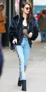 <p>Hadid gave her casual ensemble a sexy Valentine's Day twist by layering flame-print jeans by Sandro and a fur jacket over a lacy black bodysuit from Gooseberry Intimates ($139; <a rel="nofollow noopener" href="https://gooseberryintimates.com/collections/honey-bee/products/honey-bee-body-black" target="_blank" data-ylk="slk:gooseberryintimates.com;elm:context_link;itc:0;sec:content-canvas" class="link ">gooseberryintimates.com</a>).</p>