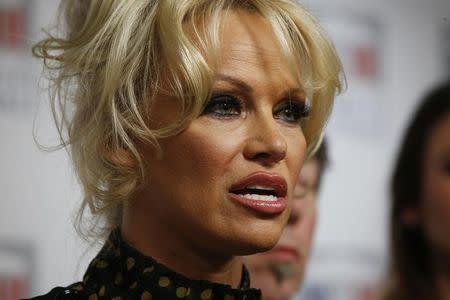 Pamela Anderson, actress and animals rights defender, attends a news conference at the National Assembly to protest the force-feeding of geese used in the production of foie gras, in Paris, France, January 19, 2016. REUTERS/Philippe Wojazer