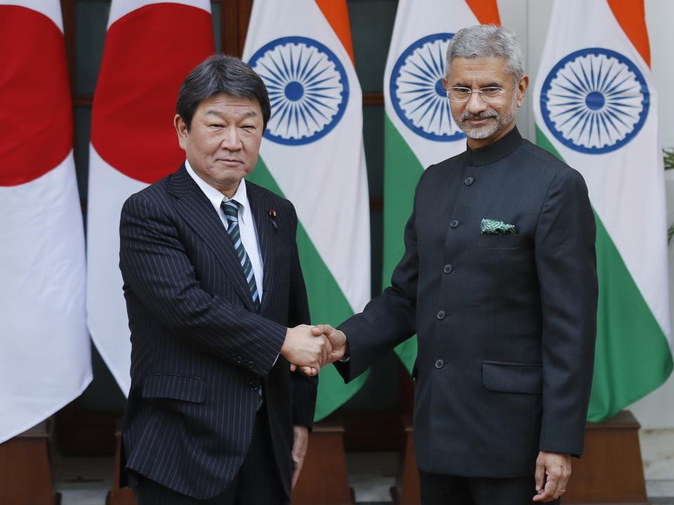 Indian Foreign Minister S. Jaishankar, right, shakes hand with his Japanese counterpart Toshimitsu Motegi before the start of India Japan 2+2 talks in New Delhi, India, Saturday, Nov. 30, 2019, to boost bilateral security and Defense cooperation between the two countries. (AP Photo/Manish Swarup)