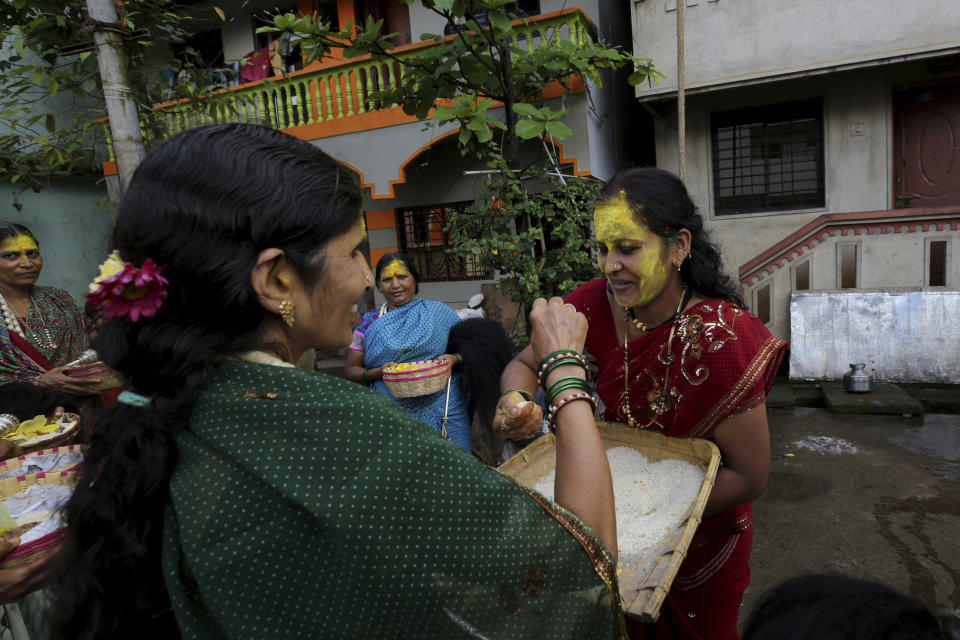 Hindu women perform rituals as they participate in festivities of a religious occasion in Belagavi, India, Oct. 7, 2021. A 2020 Pew Research Center study found that roughly two-thirds of Hindus in India want to prevent their own from marrying outside the faith. An even larger share of Muslims, nearly 80%, said favored preventing inter-religious marriages. (AP Photo/Aijaz Rahi)