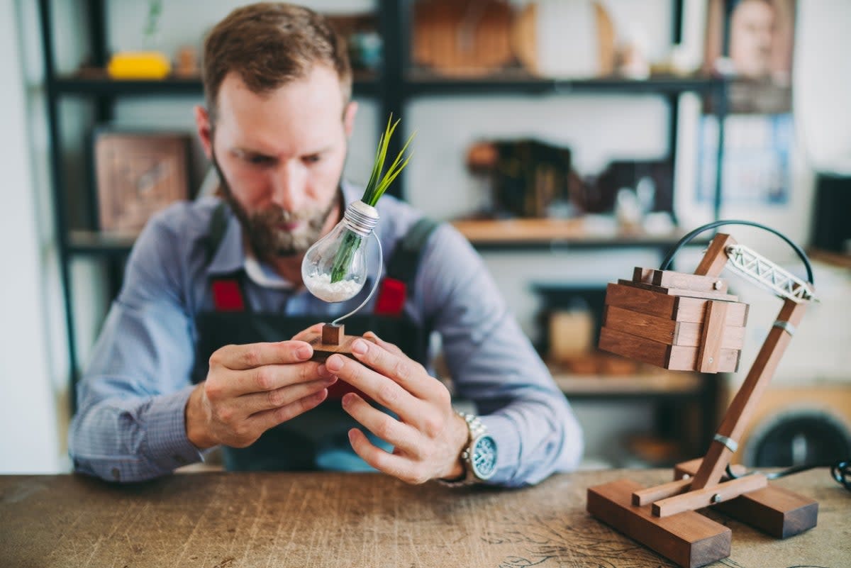 Man working on light bulb craft