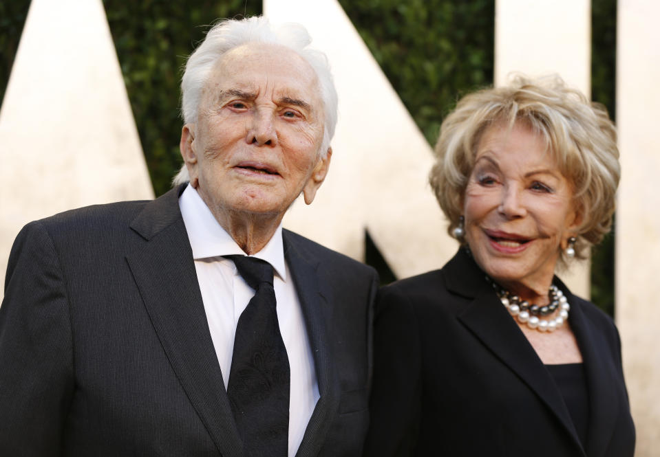 Kirk Douglas and wife Ann Buydens at the 2013 Vanity Fair Oscars Party in West Hollywood, California February 24, 2013.  REUTERS/Danny Moloshok  (UNITED STATES TAGS:ENTERTAINMENT) (OSCARS-PARTIES)