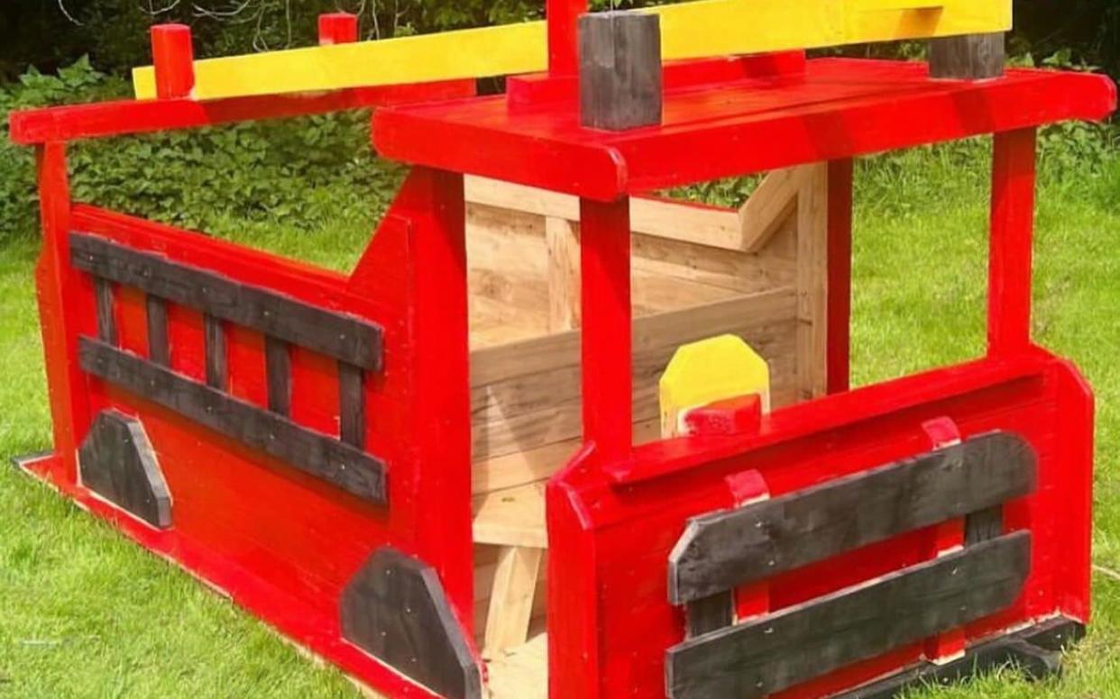 Carrie Johnson painted the wooden truck red while her son was asleep